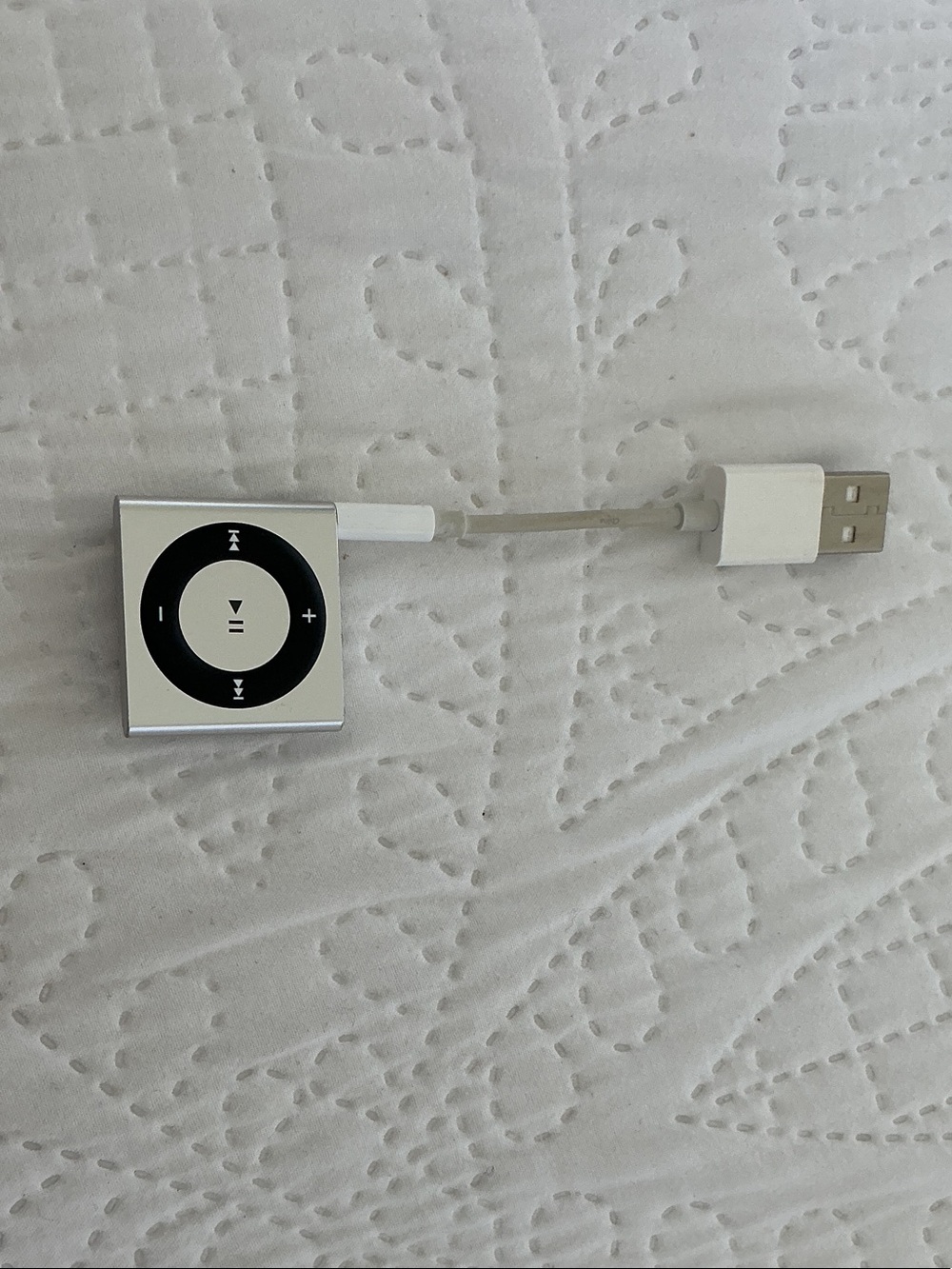 Silver Clip-Style Apple iPod Shuffle Model A1373 with Apple Earbuds and charger